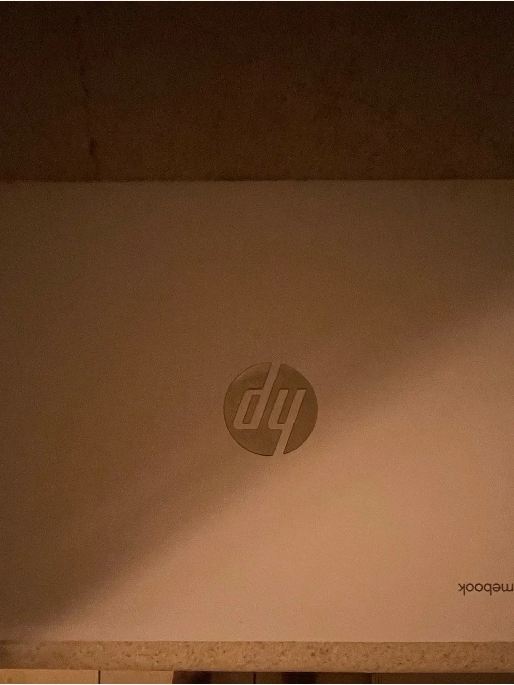 White and silver HP Chromebook with keyboard lights
